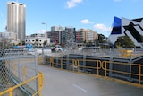 An empty space at the Perth City Link development near Perth Arena, with fences in the foreground of a work site.