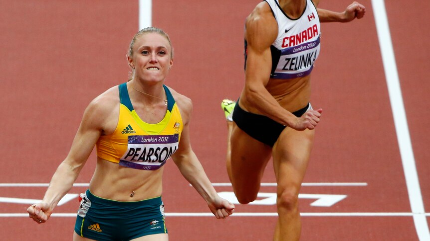 Australia's Sally Pearson (L) celebrates after beating Canada's Jessica Zelinka to take out semi-final one of the 100m hurdles.
