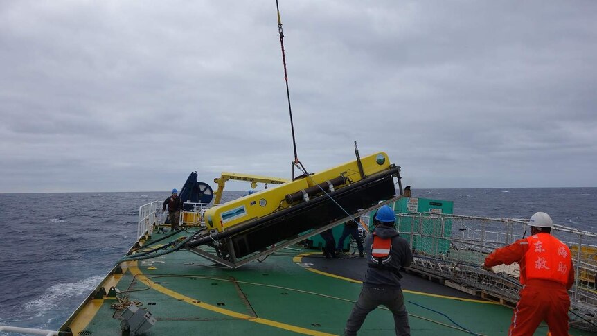 A towfish is hauled aboard from the ocean during the search for MH370.