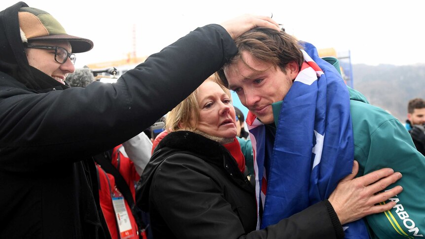 Scotty James cries as he hugs his mother after winning bronze at the 2018 Olympic Winter Games.