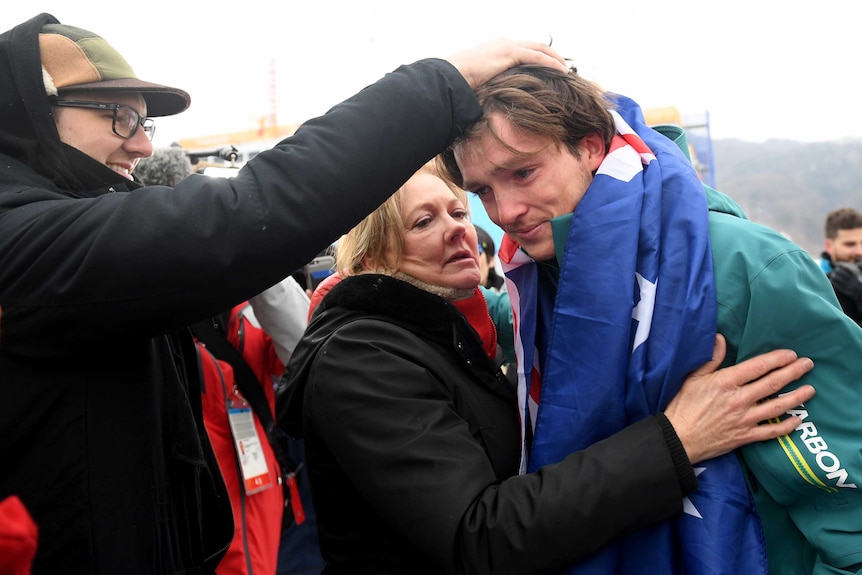 Scotty James cries as he hugs his mother after winning bronze at the 2018 Olympic Winter Games.