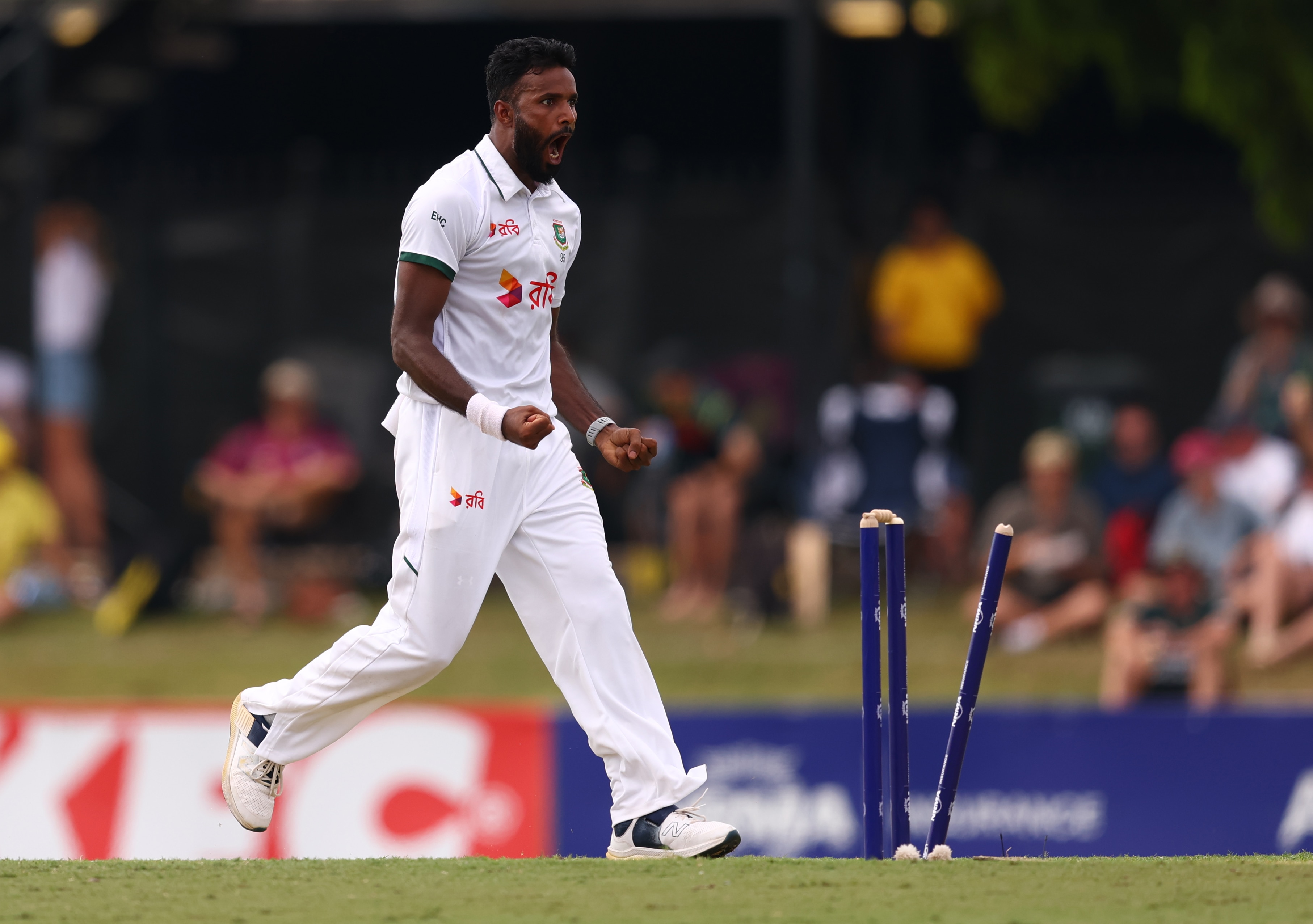 Ebadot Hossain screams as he runs past splintered stumps
