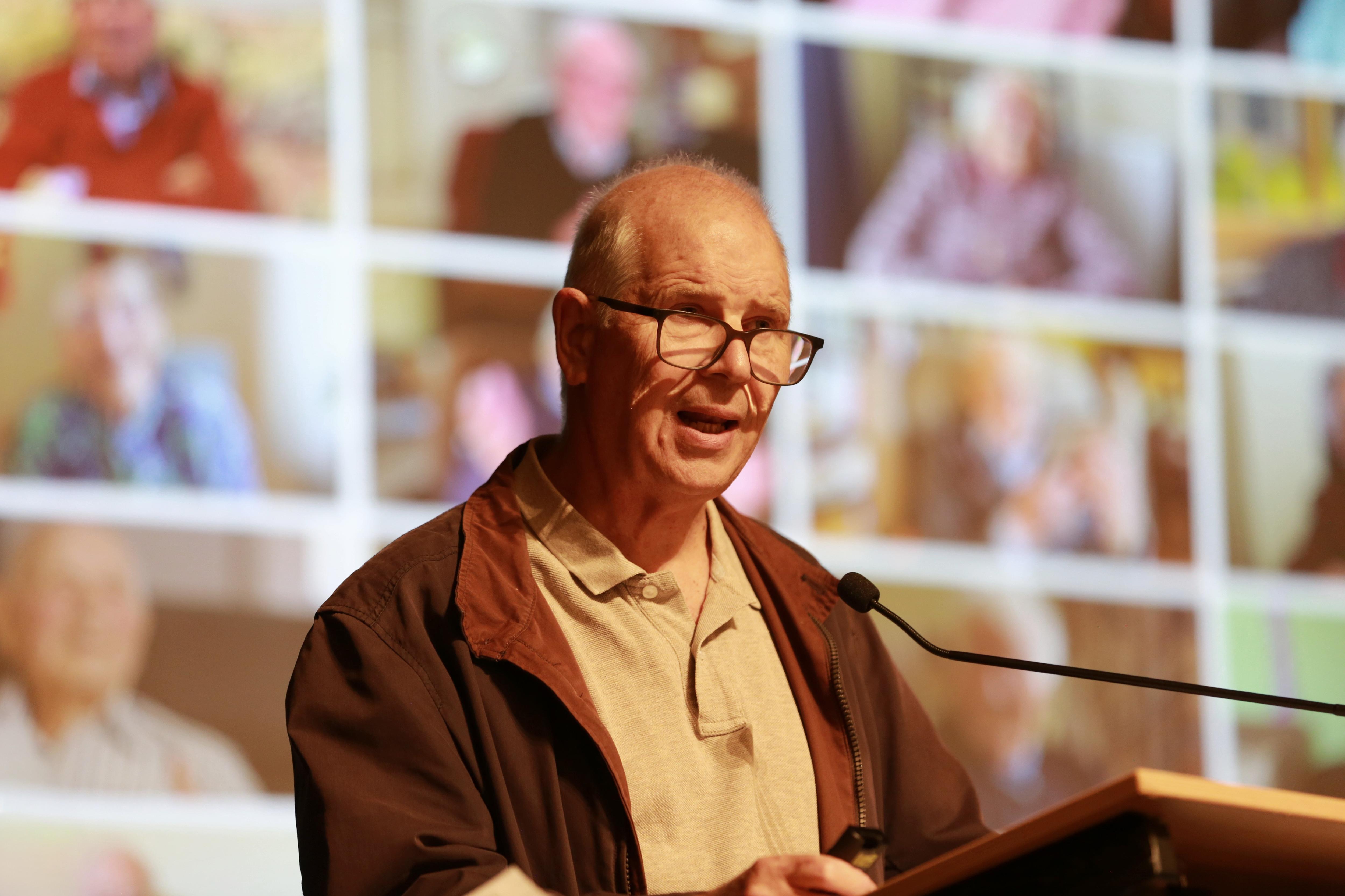 A man delivers a speech at a podium