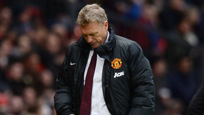 United manager David Moyes looks down as his side loses again
