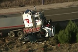 The scene of a crash between a ute and a truck.