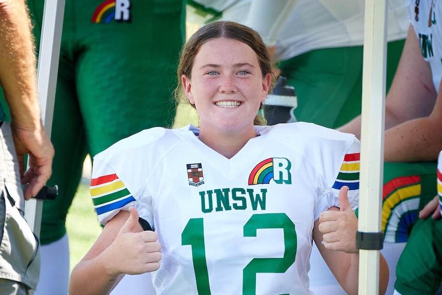 A UNSW Raiders player gives a thumbs up.