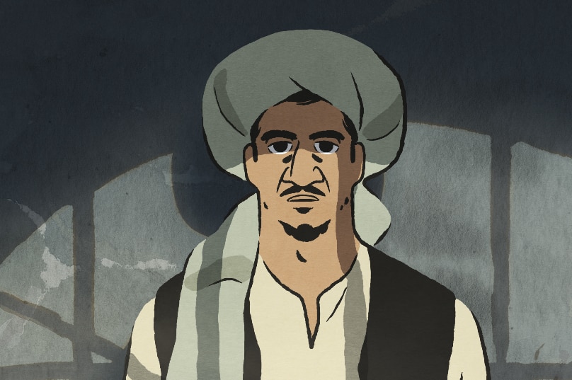 In an animated scene a man in Afghan clothing and turban stands near grey wall half in the light and shadow cast from window.