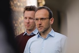 Greens party members Max Chandler-Mather and Adam Bandt at a press conference. 