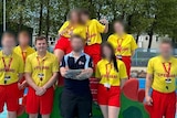 group of lifeguards, most with faces blurred