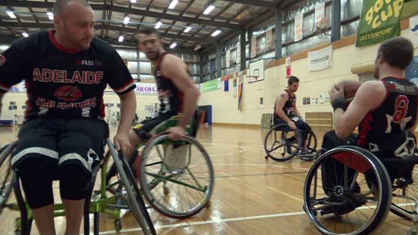 Wheelchair basketballers on the court.