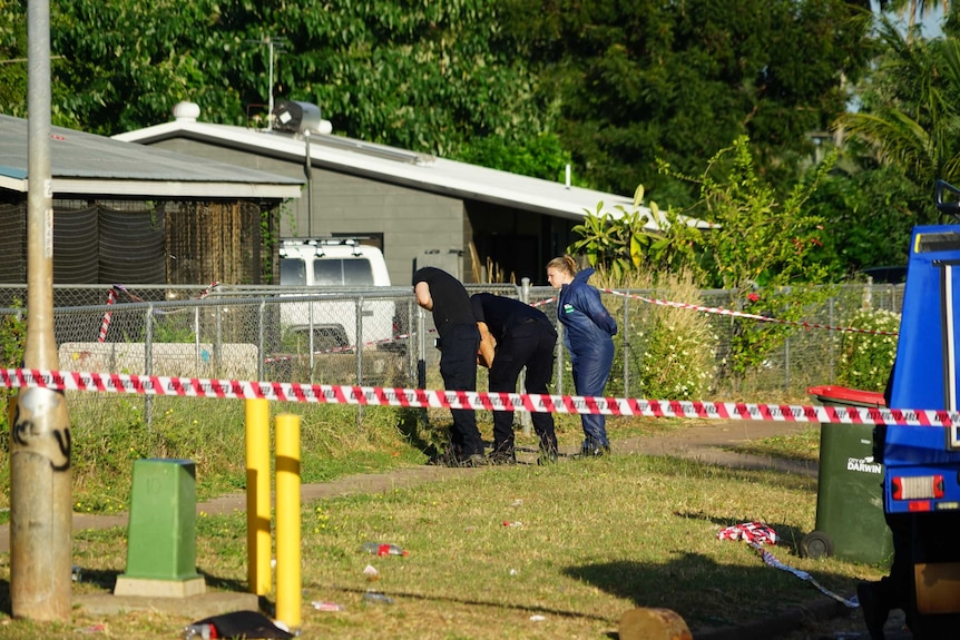 A photo of police looking at a garden