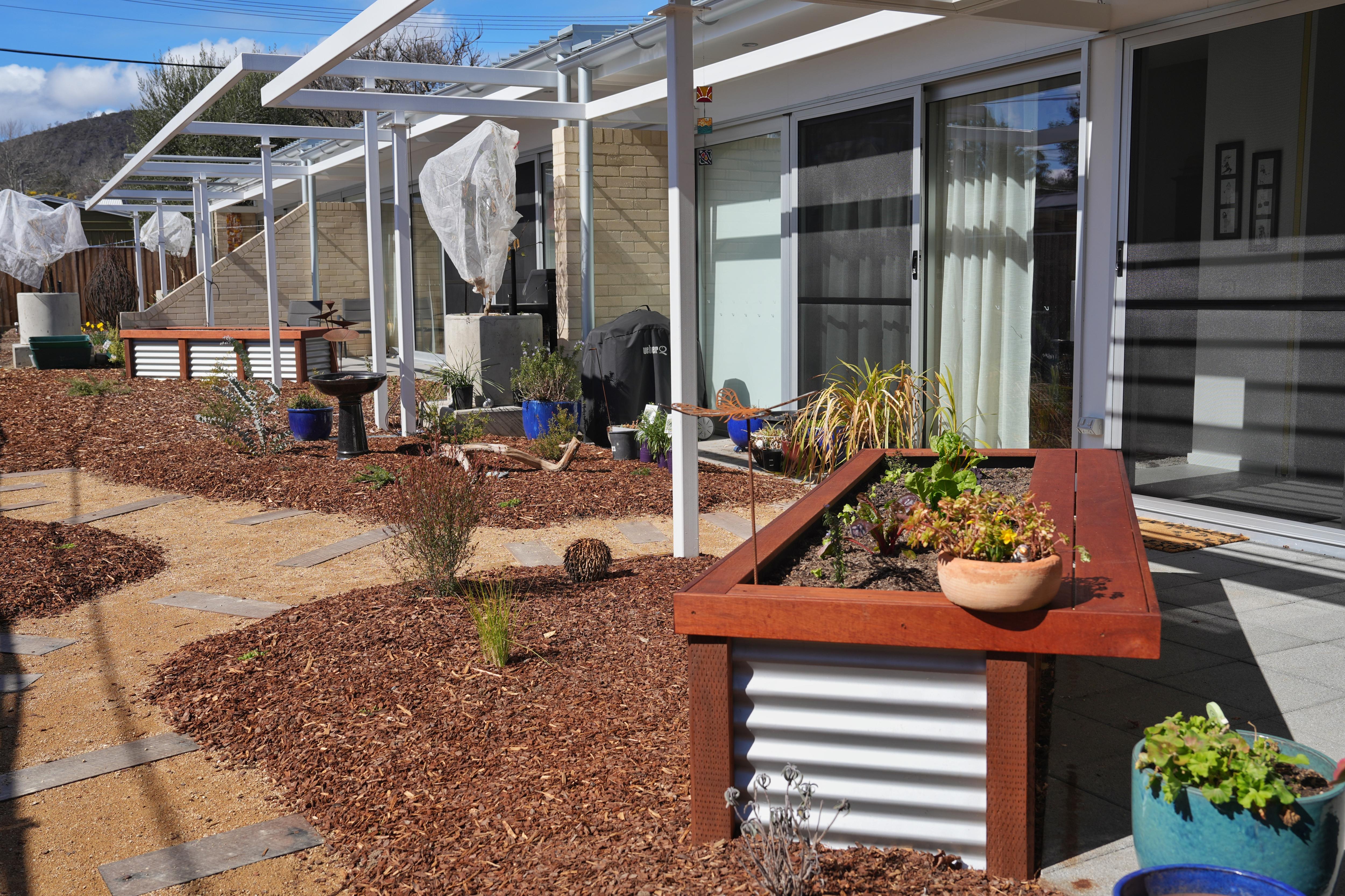 The exterior of the properties and a newly planted garden.