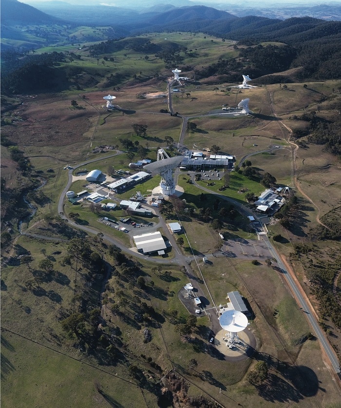 An aerial view of the CDSCC, with numerous large dishes on the ground