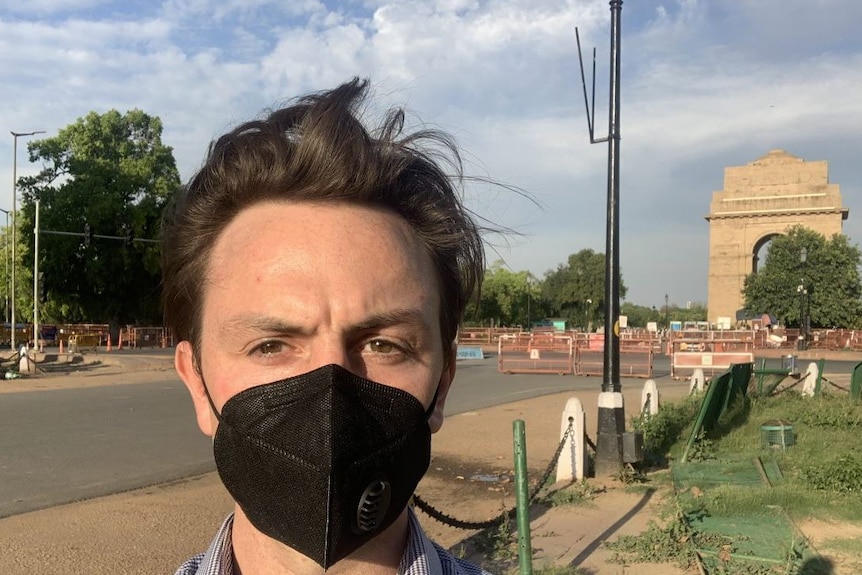 James Oaten standing on a street corner in New Delhi