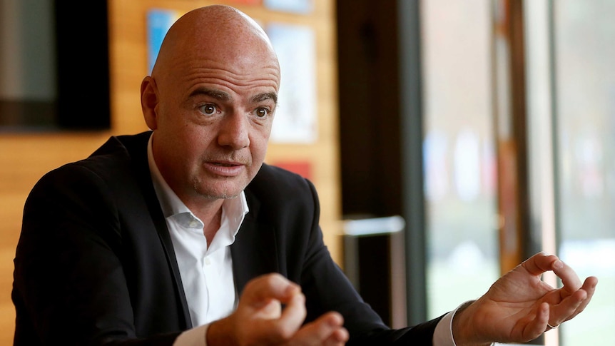Gianni Infantino gestures during a press conference.