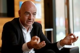 Gianni Infantino gestures during a press conference.