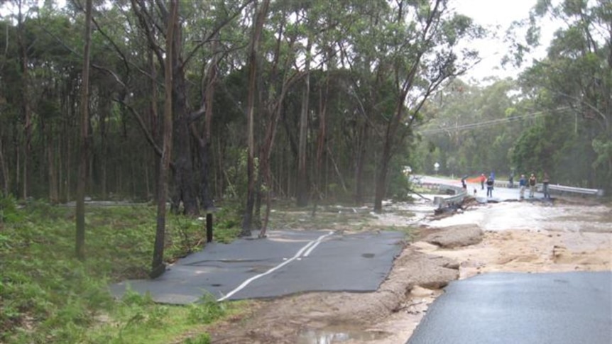 The tarmac washed away from the Tasman Highway during flooding at St Helens on Tasmania's east coast