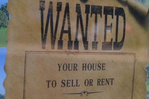 Poster in old fashioned font saying Wanted - your house to sell or rent, we are still experiencing unprecedented demand