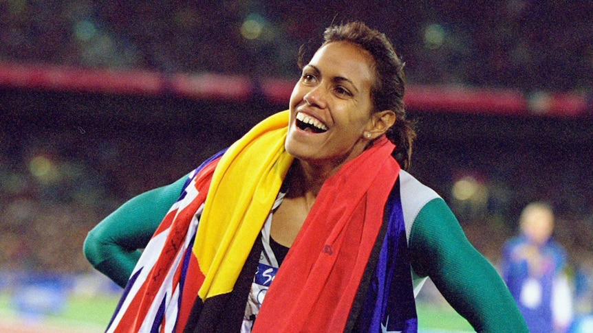Cathy Freeman celebrates gold in the women's 400m final at the Sydney 2000 Olympic Games.