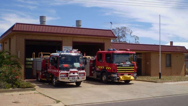 A fire station with two fire trucks