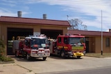 A fire station with two fire trucks