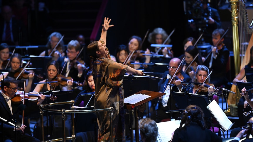 Conductor Dalia Stasevska at a crescendo point in the Proms 2023 Opening Concert at the Royal Albert Hall London