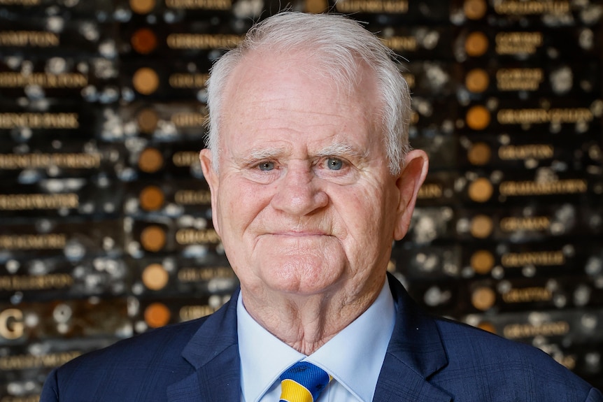 Close up photo of an older white male with blue eyes 