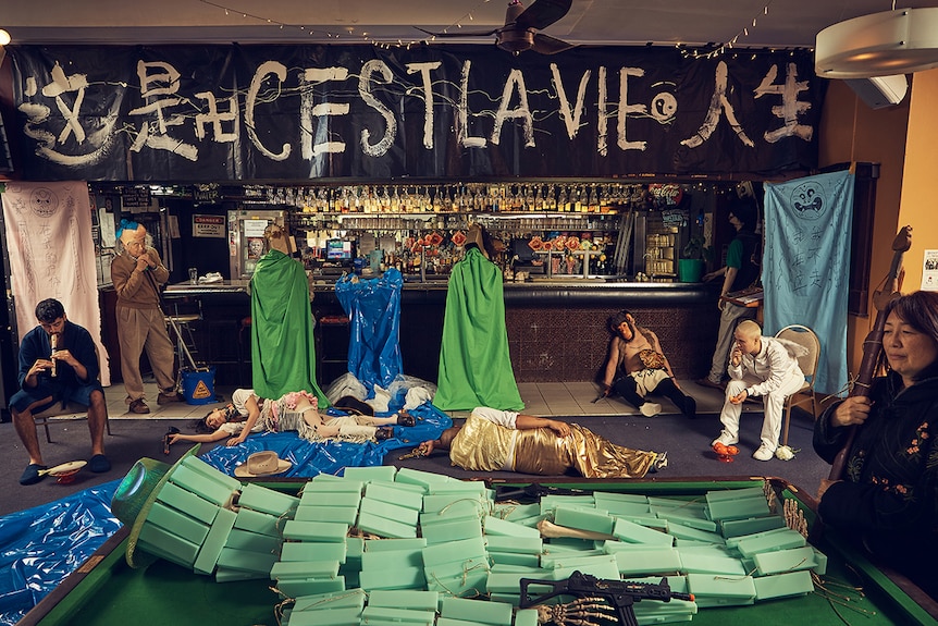 Colour photographic artwork of various characters in a bar by artist Jason Phu.