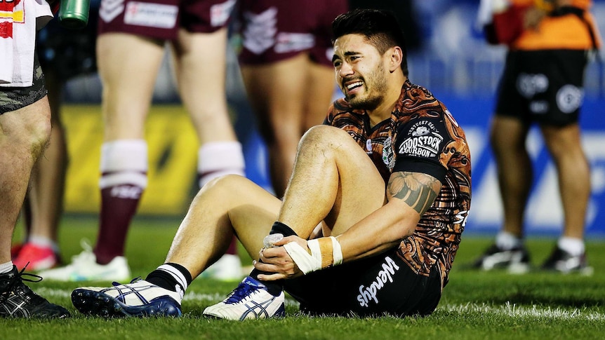 Season over ... Shaun Johnson grimaces after sustaining an ankle injury against the Sea Eagles