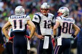 New England Patriots quarterback Tom Brady talks to receivers Julian Edelman and Danny Amendola ahead of Super Bowl XLIX
