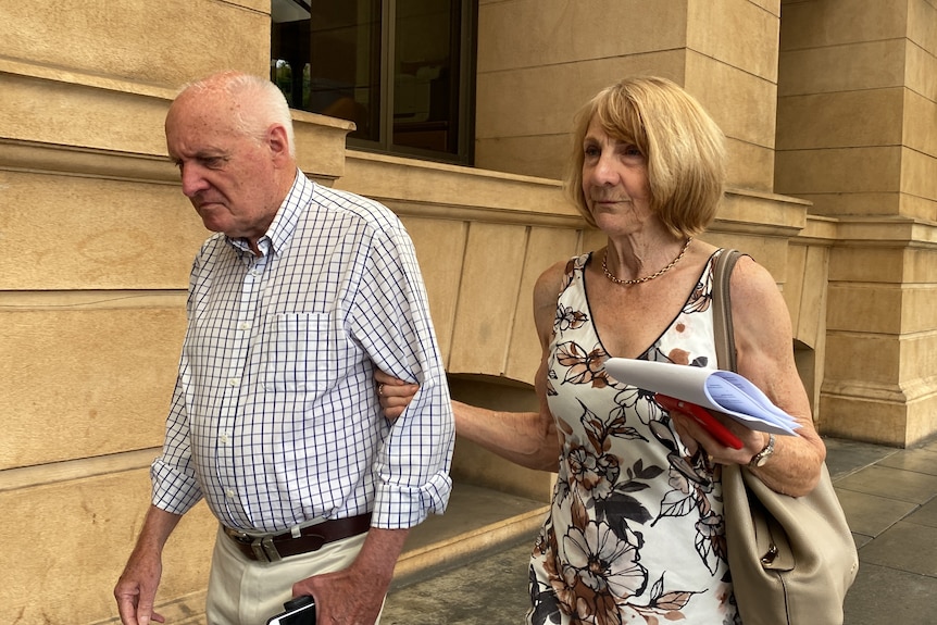 John Malcolm West walking with his wife Verna Burnard holding his arm