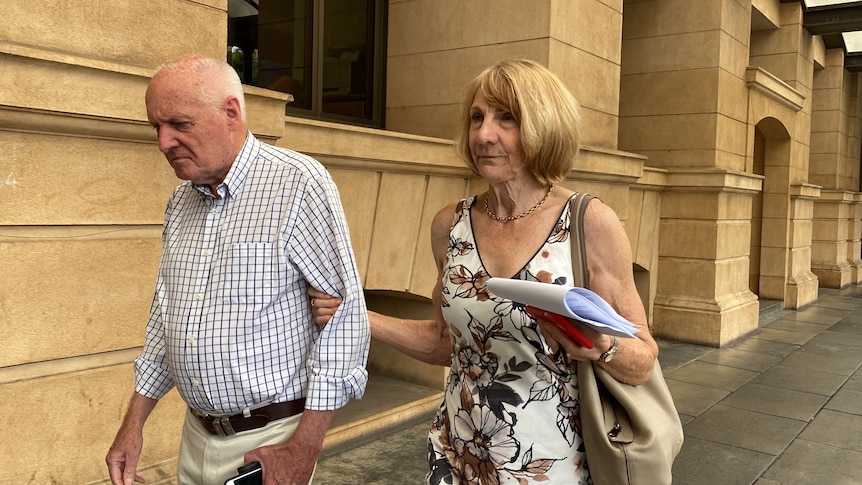 John Malcolm West walking with his wife Verna Burnard holding his arm