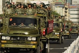 Chinese paramilitary police trucks in downtown Urumqi, China