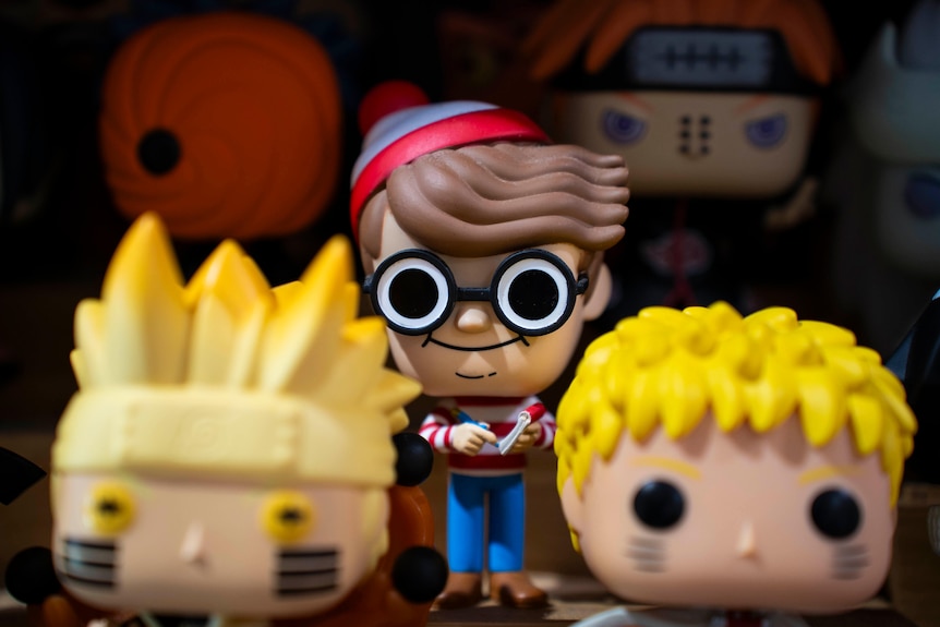 close up of three pop vinyl figurines with Where's Wally character the focal point