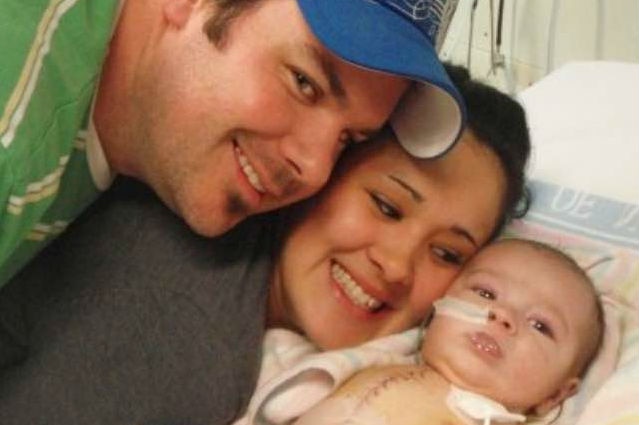 Memphis Jackson as a baby, with his mum and dad