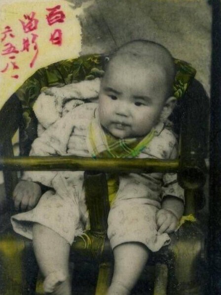A black and white photo of baby Yang.