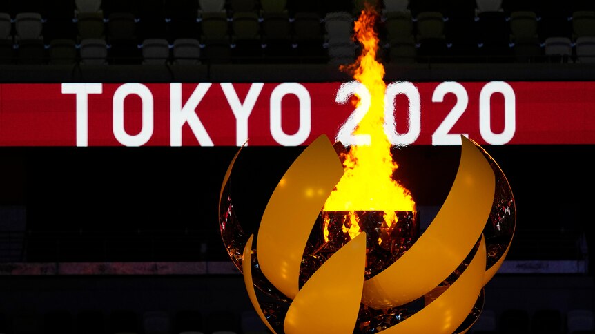 The Olympic flame burns after the opening ceremony