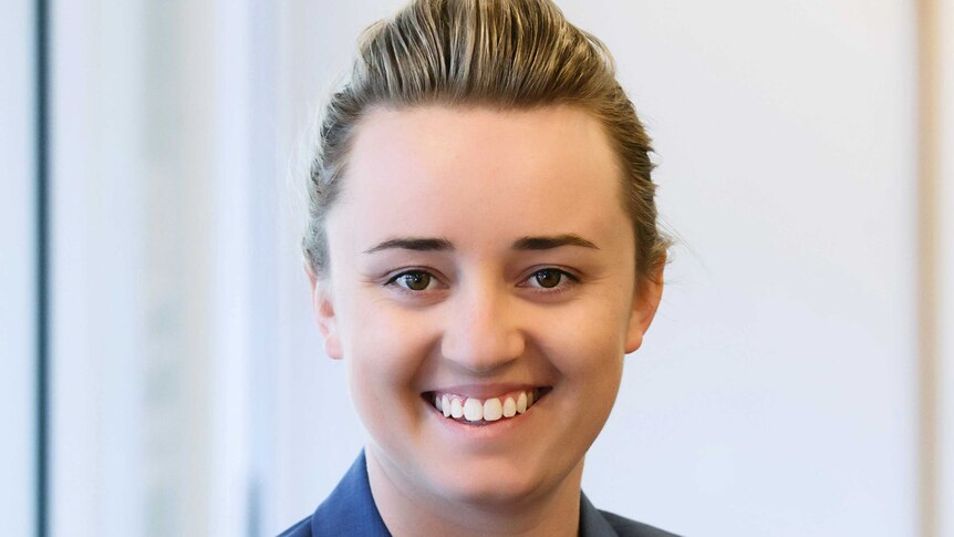 Young Canberra lawyer Caitlin Meers smiling