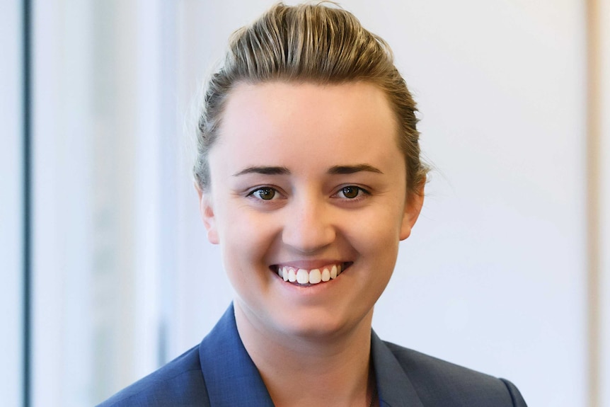 Young Canberra lawyer Caitlin Meers smiling