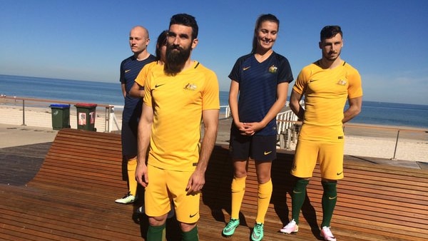 Mile Jedinak, the Matildas and Socceroos pose with new kits