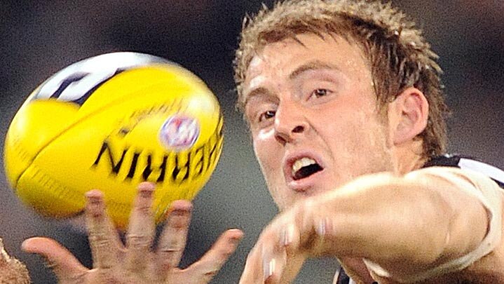 Ben Reid contests for the ball during an AFL match