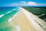 Aerial view of the blue water and white sand of the beach at Kawana on Queensland's sunshine coast