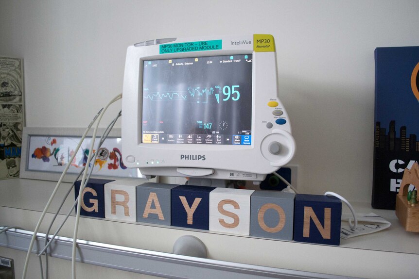 Grayson's name is spelled out in blocks underneath his heart-rate monitor.