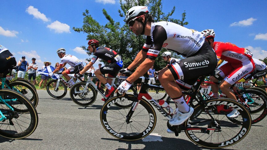 Michael Matthews, foreground, rides in the peloton on stage two of the Tour de France.