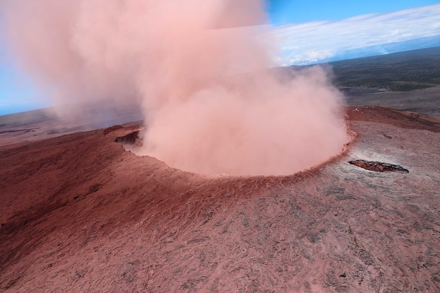 Ash rises from a crater on the Kilaueaa Volcano