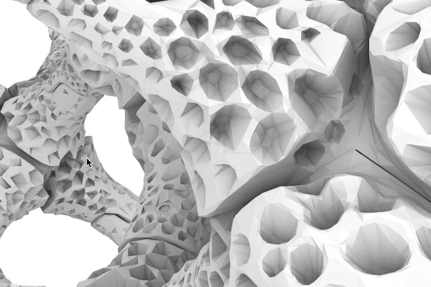 You view a close-up of a skeleton-like structure designed to mimic coral that has various perforations. 