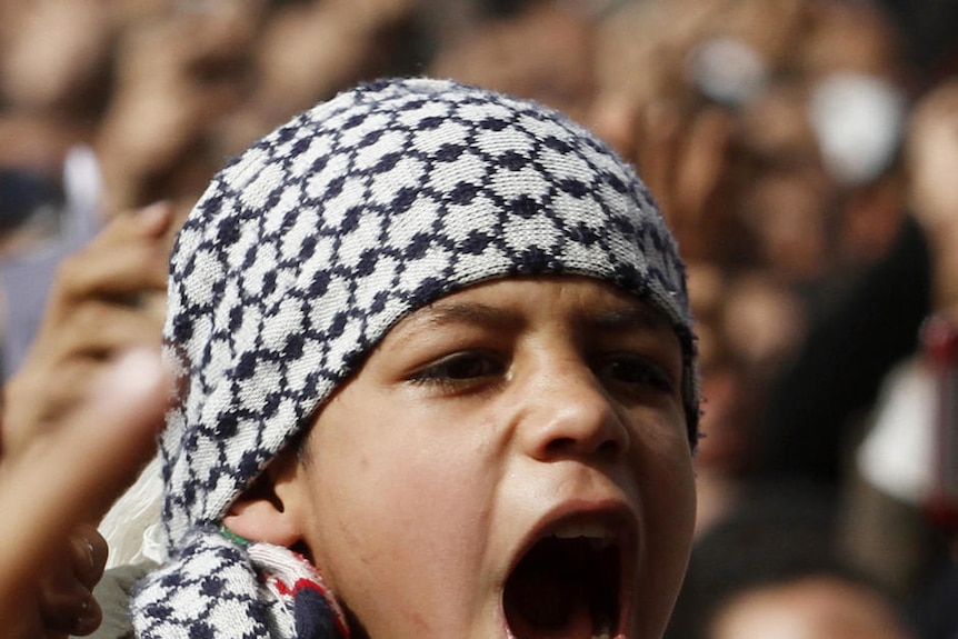 A boy shouts anti-Mubarak slogans after Friday prayers at Tahrir Square on February 4, 2011. (Reuters: Mohamed Abd El-Ghany)
