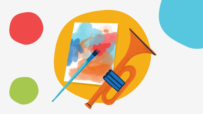 Paintbrush and paper alongside a trumpet