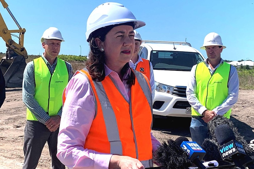 Premier Annastacia Palaszczuk at a building site in a hard hat