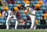 Australia's Cameron Bancroft hits a six off England's Moeen Ali on day four at the Gabba.